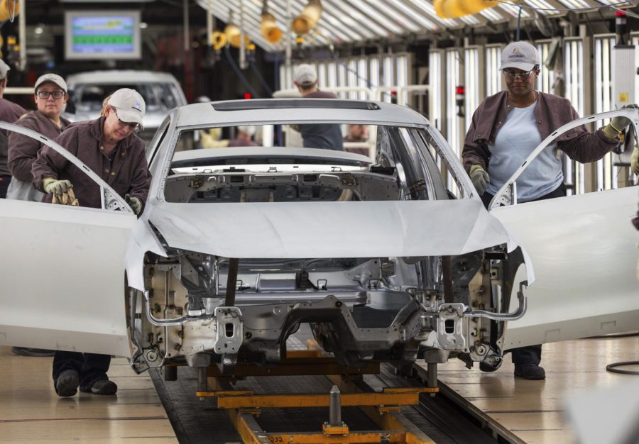 FILE - In this Aug. 31, 2017, file photo, workers produce vehicles at Volkswagen's U.S. plant in Chattanooga, Tenn. More than 1,000 workers at the Tennessee factory have signed cards authorizing a vote to be represented by the United Auto Workers union. It's the first plant in the nation to reach that milestone in the UAW’s quest to organize more than a dozen nonunion factories. The union says in a statement Thursday, Dec. 7, 2023 that the workers signed on in less than a week. (AP Photo/Erik Schelzig, File)