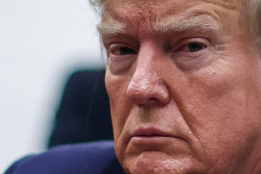 Former President Donald Trump sits at the defense table while waiting for proceedings to begin in his civil business fraud trial at New York Supreme Court, Thursday, Dec. 7, 2023, in New York. (Mike Segar/Pool via AP)