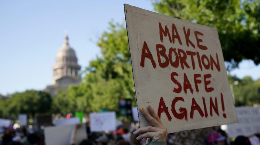 FILE - Demonstrators march and gather near the state capitol following the Supreme Court's decision to overturn Roe v. Wade, Friday, June 24, 2022, in Austin, Texas. A pregnant Texas woman whose fetus has a fatal diagnosis asked a court Tuesday, Dec. 5, 2023, to let her terminate the pregnancy, bringing what her attorneys say is the first lawsuit of its kind in the U.S. since Roe v. Wade was overturned last year. (AP Photo/Eric Gay, File)