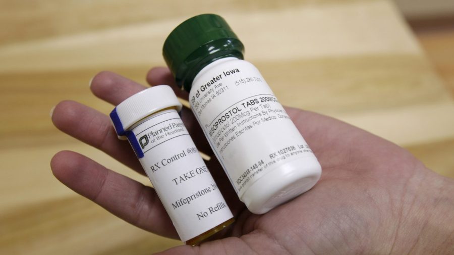 FILE - Bottles of abortion pills mifepristone, left, and misoprostol, right, at a clinic in Des Moines, Iowa, on Sept. 22, 2010. (AP Photo/Charlie Neibergall, File)