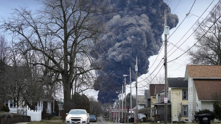 FILE - A black plume rises over East Palestine, Ohio, as a result of a controlled detonation of a portion of the derailed Norfolk Southern trains, Feb. 6, 2023. The Biden administration is initiating a formal evaluation of risks posed by vinyl chloride, the cancer-causing chemical that burned in a towering plume of toxic black smoke following a fiery train derailment earlier this year in eastern Ohio. (AP Photo/Gene J. Puskar, File)