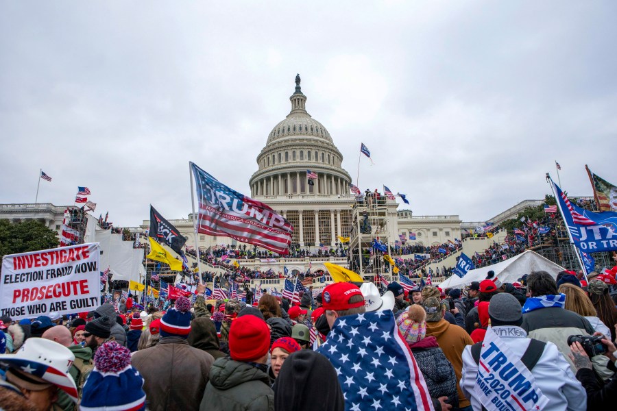 FILE - Rioters loyal to President Donald Trump at the U.S. Capitol in Washington, Jan. 6, 2021. Matthew Thomas Krol, 65, of Linden, Michigan, described by prosecutors as a self-professed militia leader, was sentenced on Friday to more than four years in prison for attacking law enforcement officers with a stolen police baton during the Jan. 6, 2021, riot at the U.S. Capitol. Krol assaulted at least three officers, injuring one of them, with the baton that he took from police. (AP Photo/Jose Luis Magana, File)