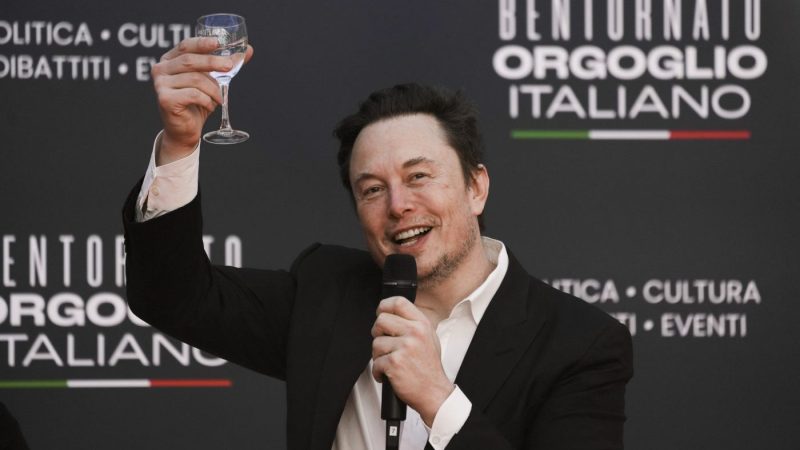 Tesla and SpaceX's CEO Elon Musk cheers as he speaks at the annual political festival Atreju, organized by the Giorgia Meloni's Brothers of Italy political party, in Rome, Saturday, Dec. 16, 2023. (AP Photo/Alessandra Tarantino)