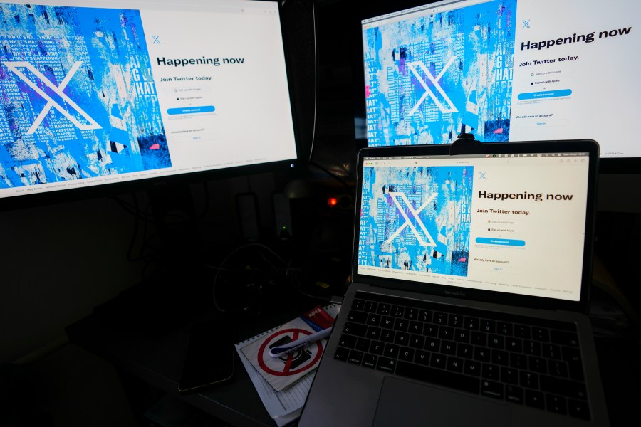 FILE - Computer monitors and a laptop display the X, formerly known as Twitter, sign-in page, July 24, 2023, in Belgrade, Serbia.E uropean Union authorities are looking into whether Elon Musk’s online platform X breached tough new social media regulations, in the first such investigation since the rules designed to make online content less toxic took effect. European Commissioner Thierry Breton announced Monday, Dec. 18, 2023 the opening of "formal infringement proceedings against X” under the Digital Services Act. (AP Photo/Darko Vojinovic, File)