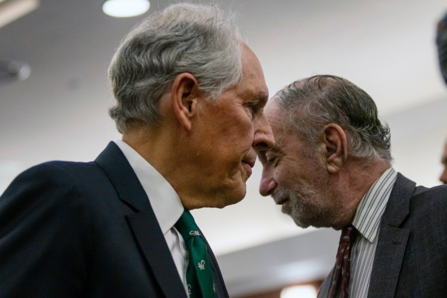 Defense attorney Richard Wright, foreground, attends court in Las Vegas, on Monday, Dec. 18, 2023, where six Republicans pleaded not guilty to two felony charges each, stemming from their roles as fake electors in 2020 where they signed certificates falsely claiming former President Donald Trump won Nevada over Joe Biden. (AP Photo/Ty O'Neil)