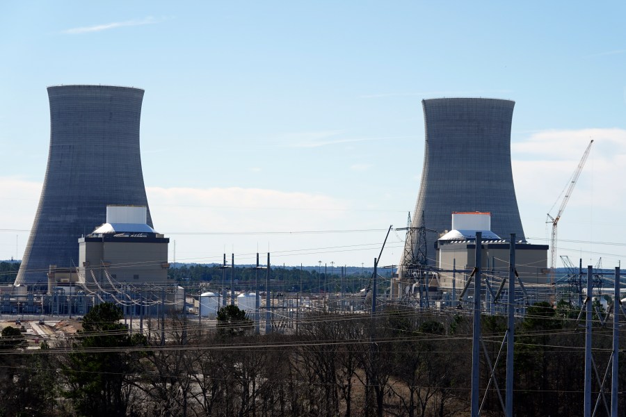 FILE - Units 3, left, and 4 and their cooling towers stand at Georgia Power Co.'s Plant Vogtle nuclear power plant, Jan. 20, 2023, in Waynesboro, Ga. Georgia's Public Service Commission voted 5-0 on Tuesday, Dec. 19, 2023 to approve a 6% rate increase for remaining costs that will take effect once Unit 4 begins commercial operation. (AP Photo/John Bazemore, File)