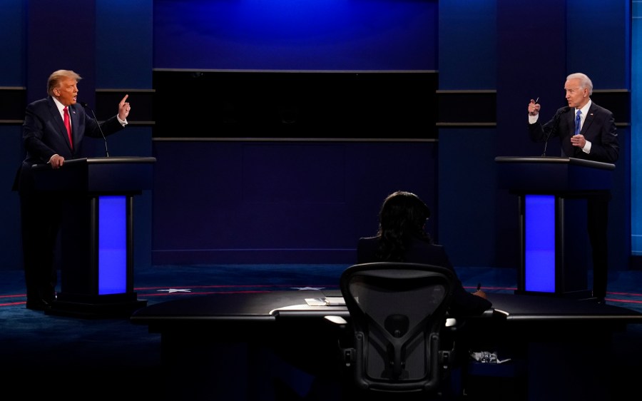 FILE - U.S. President Donald Trump, left, and Democratic presidential candidate former Vice President Joe Biden attend the second and final presidential debate Oct. 22, 2020, at Belmont University in Nashville, Tenn. Former President Donald Trump says he is eager to debate President Joe Biden, even if the debates are sponsored by the nonpartisan Commission on Presidential Debates. And he says he is open to debating a single Republican rival if a serious challenger emerges after the New Hampshire primary. (AP Photo/Patrick Semansky, File)