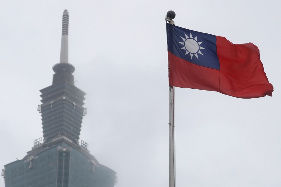 FILE - A Taiwan national flag flutters near the Taipei 101 building at the National Dr. Sun Yat-Sen Memorial Hall in Taipei, Taiwan, on May 7, 2023. (AP Photo/Chiang Ying-ying, File)