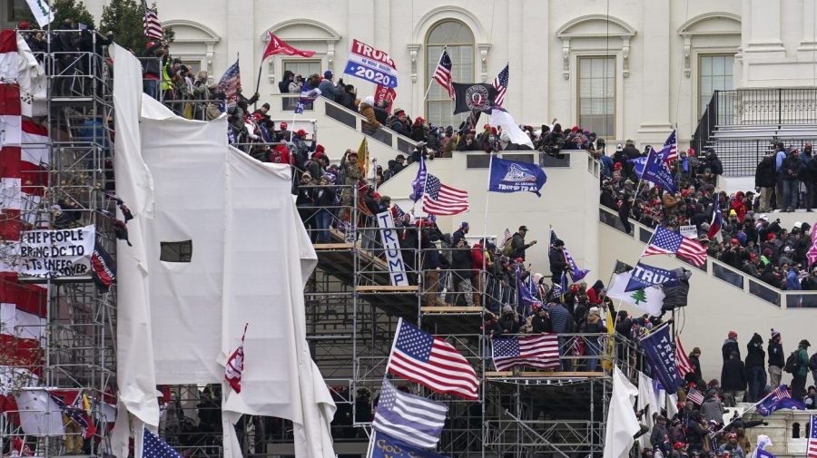 FILE - In this Jan. 6, 2021 file photo insurrectionists loyal to President Donald Trump riot outside the Capitol in Washington. (AP Photo/John Minchillo, File)