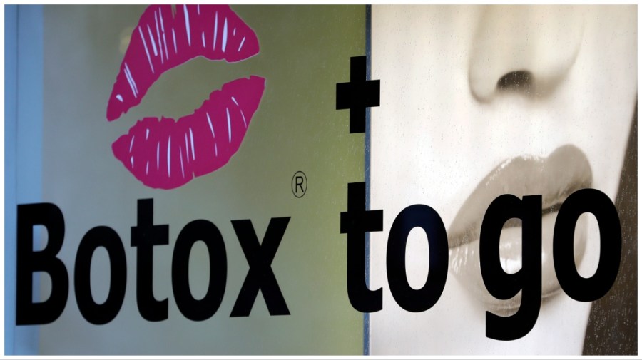 A shop offers 'Botox to go' in Berlin, Germany, Wednesday, Jan. 4, 2017. (AP Photo/Michael Sohn)