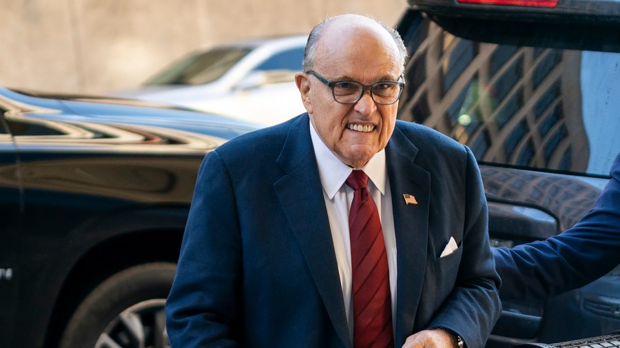 Rudy Giuliani is seen arriving at a trial.