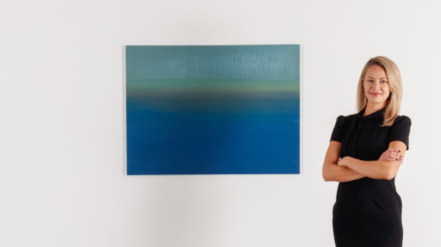 Diana Naylor stands beside her painting “Integrity.”