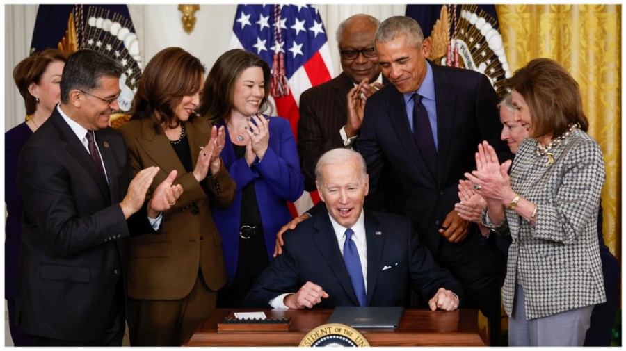 U.S. President Joe Biden gets a pat on the back from former President Barack Obama after Biden signed an executive order aimed at strengthening the Affordable Care Act during an event to mark the 2010 passage of the Affordable Care Act in the East Room of the White House on April 5, 2022 in Washington, DC. (Photo by Chip Somodevilla/Getty Images)