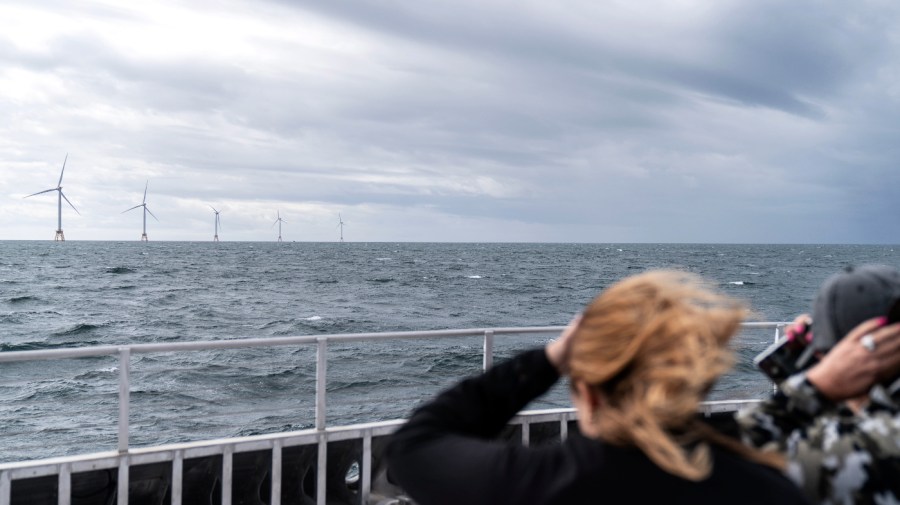Guests tour the five turbines of America's first offshore wind farm, owned by the Danish company, Orsted, off the coast of Block Island, R.I., as part of a wind power conference, Monday, Oct. 17, 2022.