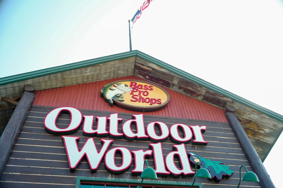 In this Sept. 19, 2017 file photo, the Bass Pro Shops logo is seen at the entrance to a store in Council Bluffs, Iowa. Police in Alabama say a man crashed his car outside a Bass Pro Shop, Thursday night, Jan. 4, 2024, and stripped down to his birthday suit and then plunged into the giant aquarium inside the store. (AP Photo/Nati Harnik, File)