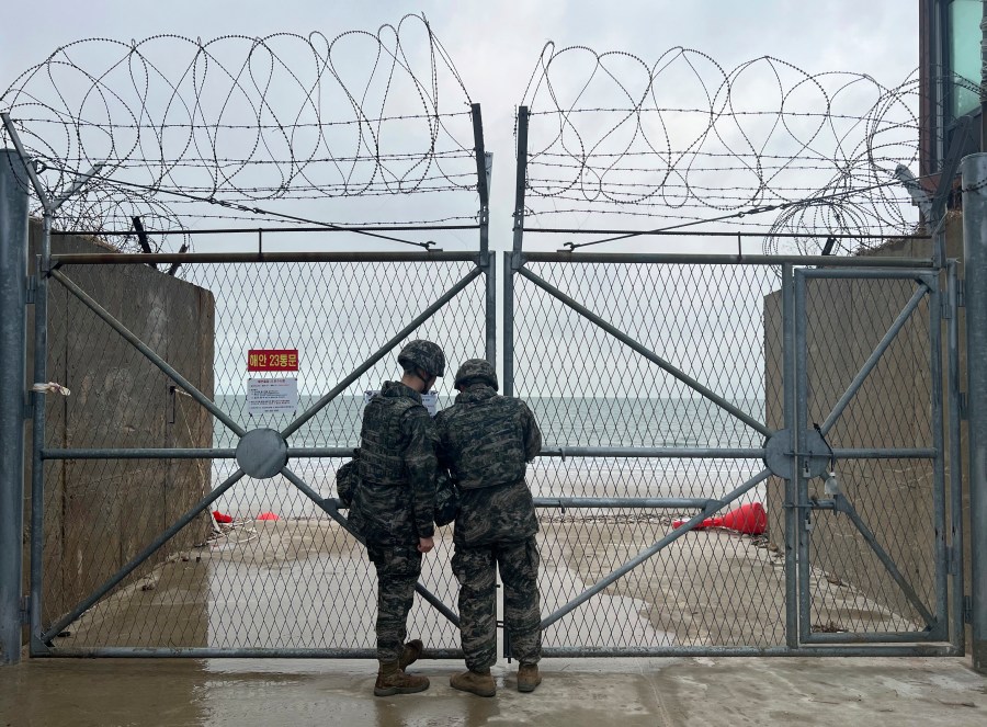 South Korean marines close a gate on Yeonpyeong Island, South Korea, Saturday, Jan. 6, 2024. The influential sister of North Korean leader Kim Jong Un mocked South Korea’s ability to detect weapons launches by the North on Sunday, as she denied Seoul’s claim that North Korea fired artillery shells into the sea the previous day. South Korea's military quickly dismissed her statement as “a low-level psychological warfare" and warned that it will make a stern response to any provocations by North Korea. (Park Dong-joo/Yonhap via AP)