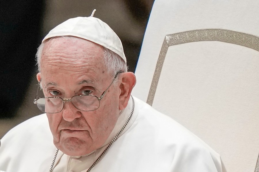 FILE - Pope Francis attends his weekly general audience in the Pope Paul VI hall at the Vatican, Wednesday, Aug. 23, 2023. Pope Francis called Monday, Jan. 8, 2024, for a universal ban on the “despicable” practice of surrogate motherhood, as he included the “commercialization” of pregnancy in an annual speech listing the threats to global peace and human dignity. (AP Photo/Andrew Medichini, File)