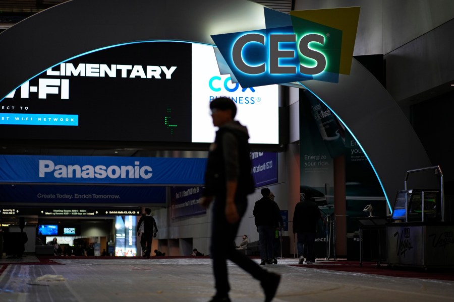 People walk through the Las Vegas Convention Center during setup ahead of the CES tech show Saturday, Jan. 6, 2024, in Las Vegas. (AP Photo/John Locher)