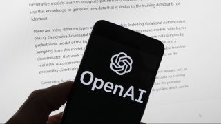 FILE - The OpenAI logo is seen on a mobile phone in front of a computer screen displaying output from ChatGPT, March 21, 2023, in Boston. A barrage of high-profile lawsuits in a New York federal court, including one by the New York Times, will test the future of ChatGPT and other artificial intelligence products. (AP Photo/Michael Dwyer, File)