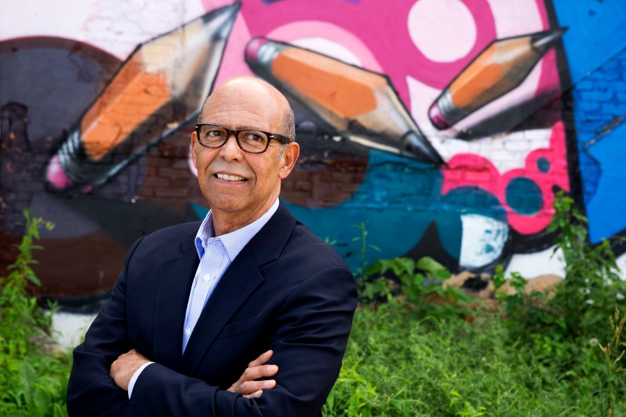 FILE - In this June 5, 2014 file photo, Michael Lomax, president of the United Negro College Fund, poses for a portrait by a painted mural in Washington. The United Negro College Fund announced a gift of $100 million from the Lilly Endowment, as part of its larger capital campaign to bolster the endowments of the 37 historically Black colleges and university that form its membership. (AP Photo/Jacquelyn Martin, File)