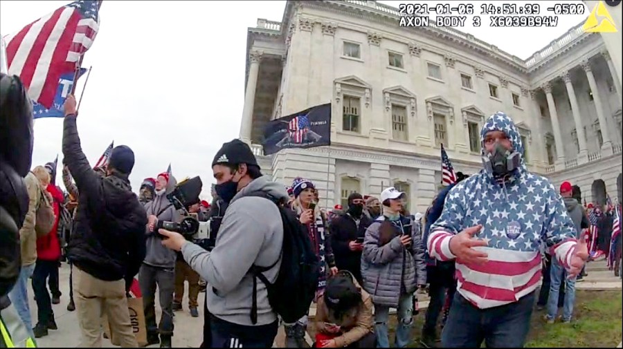 This image from police body-worn video and contained in the Justice Department statement of facts supporting the arrest of Carlos Ayala, shows Ayala outside the U.S. Capitol on Jan. 6, 2021, in Washington. Ayala, a Republican member of the Maryland State Board of Elections, was arrested on Tuesday, Jan. 9, 2024, in Maryland, on felony and misdemeanor charges for participating in the Jan. 6 rioting. Michael Summers, the chair of the Maryland elections board, said in a statement Thursday, Jan. 11, he has accepted Ayala's immediate resignation. (Department of Justice via AP)