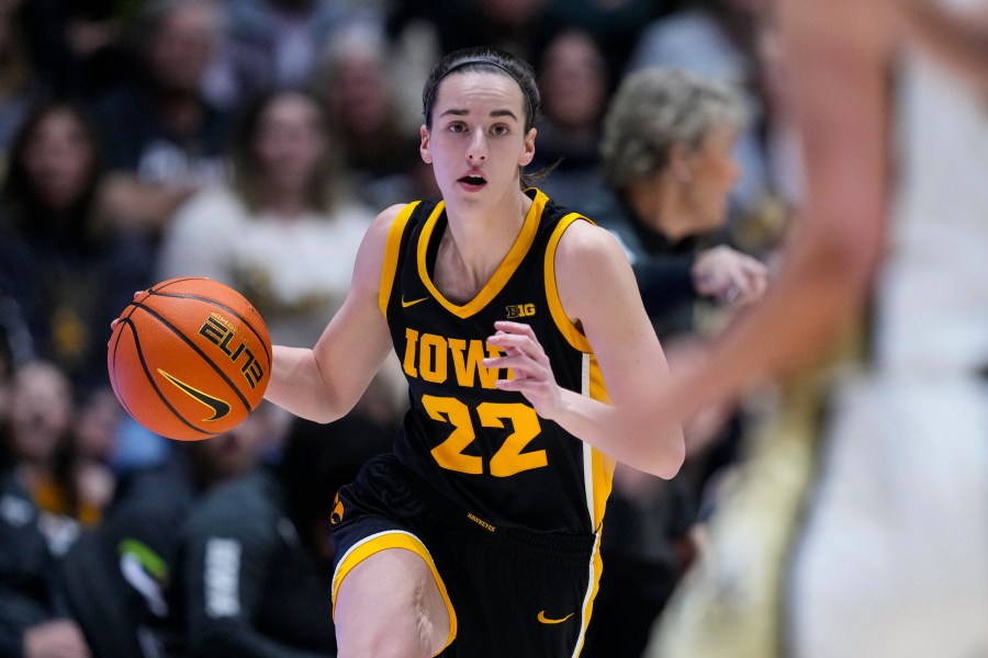 Iowa guard Caitlin Clark (22) plays against Purdue during the first half of an NCAA college basketball game in West Lafayette, Ind., Wednesday, Jan. 10, 2024. (AP Photo/Michael Conroy)