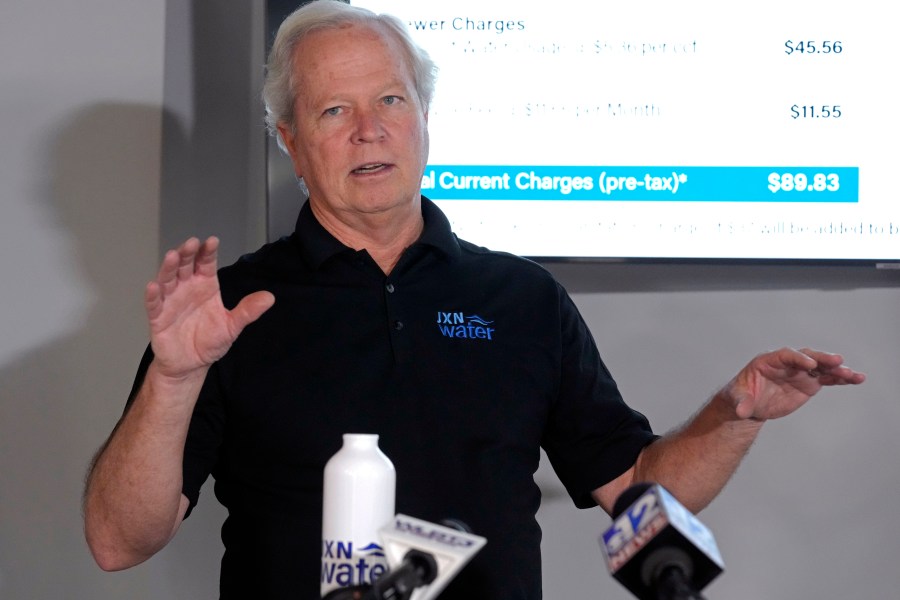 FILE - Ted Henifin, interim third-party manager for JXN Water, the water system for the city of Jackson, Miss., explains his proposal for a slight rate increase Friday, Nov. 17, 2023, during a news conference in Jackson. The day after Mississippi health officials told residents in the state’s capital that dangerous bacteria could be in their tap water, a new round of test results did not find E. coli in the city's supply, Henifin, the city's water manager said Friday, Jan. 12, 2024. (AP Photo/Rogelio V. Solis)