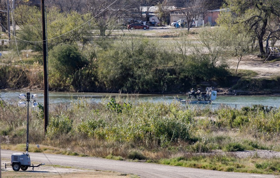 Texas Department of Public Safety officers work inside a fenced off Shelby Park, Thursday, Jan. 11, 2024, in Eagle Pass, Texas. The Justice Department on Friday, Jan. 12, asked the Supreme Court to order Texas to stop blocking Border Patrol agents from a portion of the U.S.-Mexico border where large numbers of migrants have crossed in recent months, setting up another showdown between Republican Gov. Greg Abbott and the Biden administration over immigration enforcement. (Sam Owens /The San Antonio Express-News via AP)