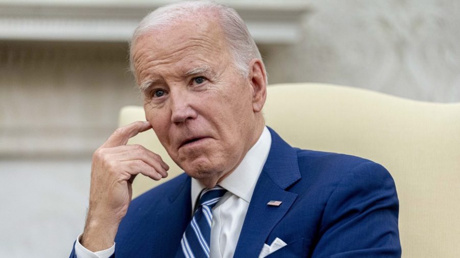 President Biden gestures during a meeting in the Oval Office.