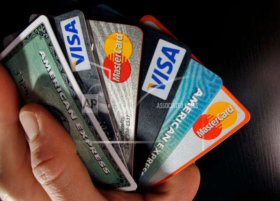 A person fans out a handful of different credit cards.