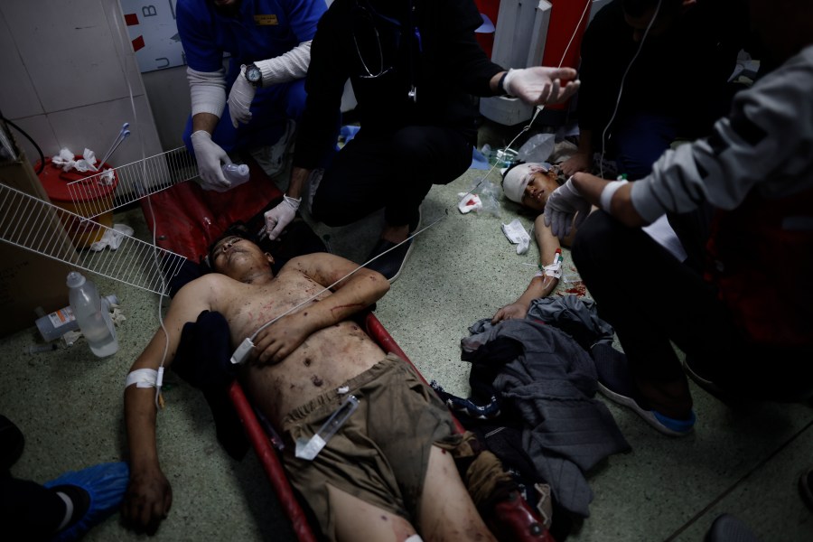 Palestinians wounded in the Israeli bombardment of the Gaza Strip are treated in a hospital in Khan Younis, Monday, Jan. 15, 2024. (AP Photo/Mohammed Dahman)