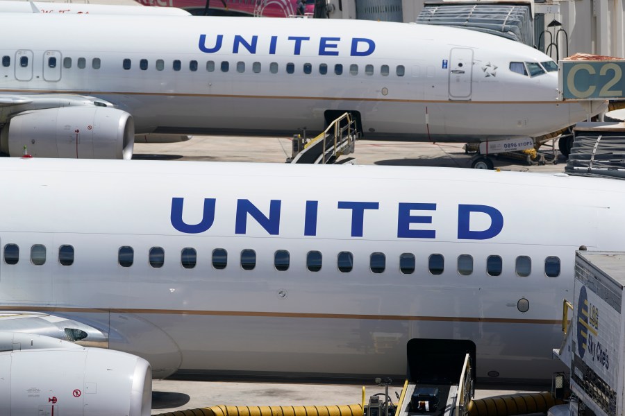 Two United Airlines Boeing 737s are parked at the gate at the Fort Lauderdale-Hollywood International Airport in Fort Lauderdale, Fla., on July 7, 2022. United Airlines said Monday, Jan. 22, 2024, it will lose money in the first three months of this year because of the grounding of its Boeing 737 Max 9 planes after a panel blew out of a Max jetliner this month. (AP Photo/Wilfredo Lee)