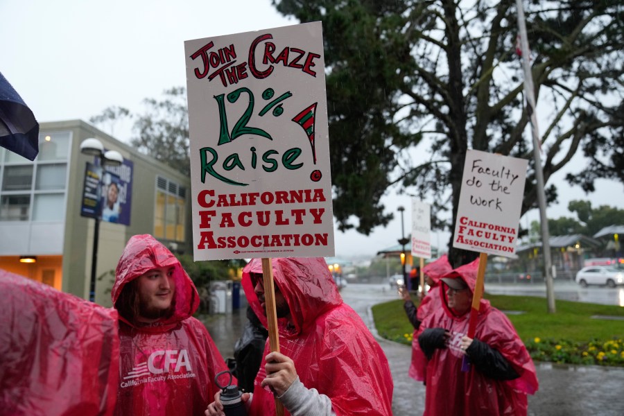 California Faculty Association members rally and picket outside San Francisco State University in San Francisco, Monday, Jan. 22, 2024. More than 30,000 professors, librarians, plumbers, electricians, and other workers at California State University, the largest public university system in the U.S., walked off the job Monday in a weeklong strike to demand higher wages, more manageable workloads and increased parental leaves. (AP Photo/Eric Risberg)