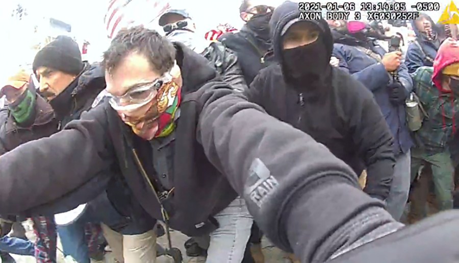 This image from police body-worn camera video, and contained in the Justice Department's sentencing memorandum, shows Marc Bru, at the U.S. Capitol on Jan. 6, 2021, in Washington. Bru, who stormed the U.S. Capitol with fellow Proud Boys extremist group members, has been sentenced to six years in prison. (Department of Justice via AP)