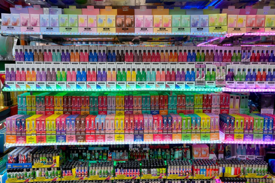 A selection of colourful disposable vapes on display for sale in a souvenir shop in London, Monday, Jan. 29, 2024. The British government says it will ban the sale of disposable vapes and limit their cornucopia of flavors in an effort to prevent children becoming addicted to nicotine. It also says it will stick to a contentious proposal to ban today’s young people from ever buying cigarettes. (AP Photo/Kirsty Wigglesworth)