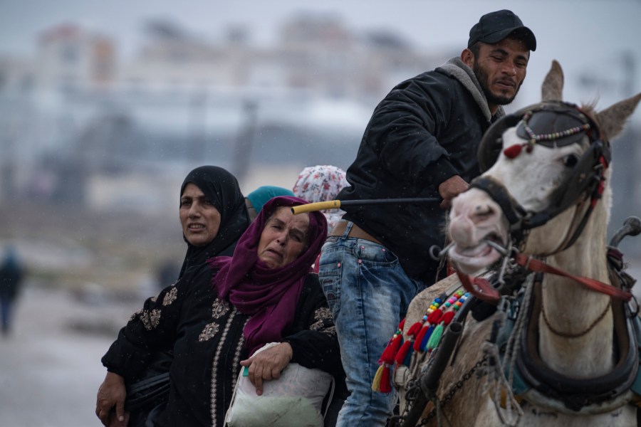 Palestinians arrive in the southern Gaza town of Rafah after fleeing an Israeli ground and air offensive in the nearby city of Khan Younis on Monday, Jan. 29, 2024. Israel has expanded its offensive in Khan Younis, saying the city is a stronghold of the Hamas militant group. (AP Photo/Fatima Shbair)