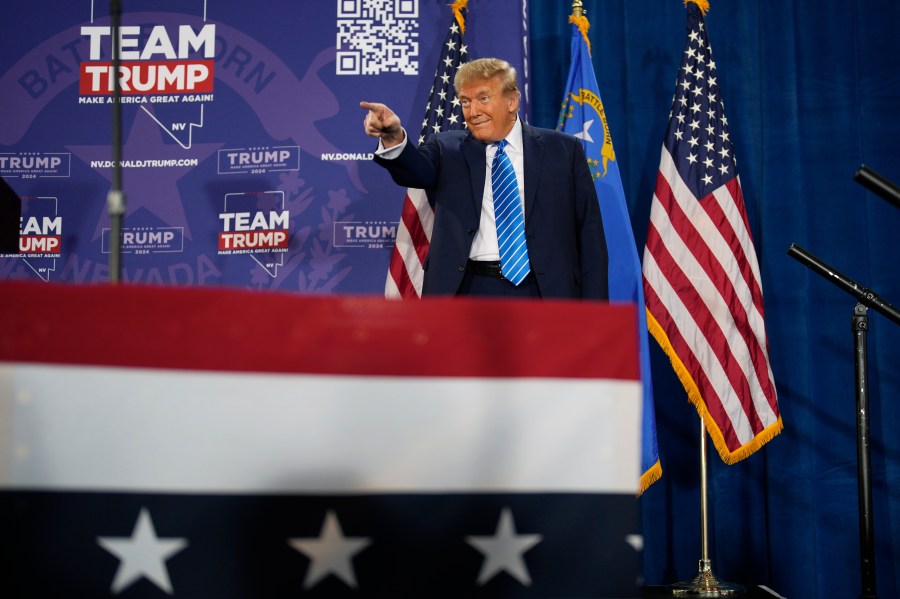 Republican presidential candidate former President Donald Trump motions before speaking at a campaign event Saturday, Jan. 27, 2024, in Las Vegas. (AP Photo/John Locher)