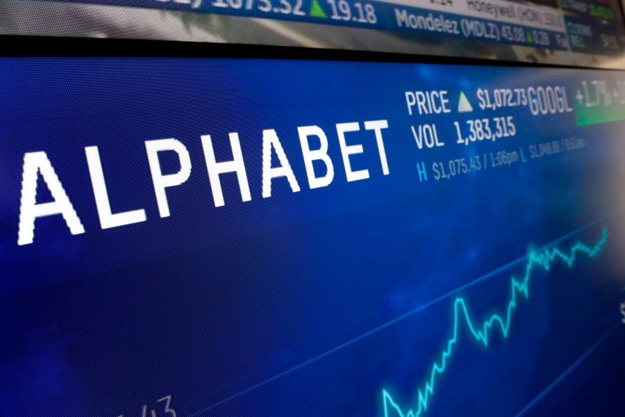 FILE - In this Feb. 14, 2018, file photo the logo for Alphabet appears on a screen at the Nasdaq MarketSite in New York. Alphabet Inc., reports their earnings on Tuesday, Jan. 30, 2024. (AP Photo/Richard Drew, File)