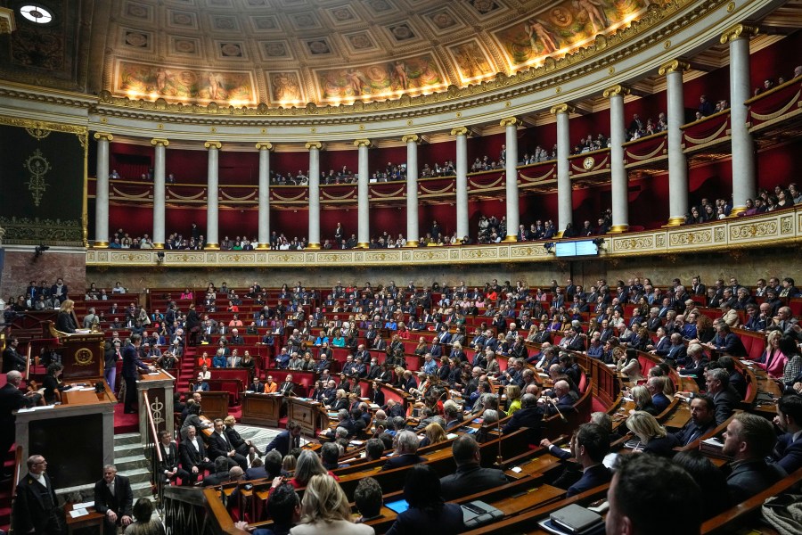 Lawmakers gather at the National Assembly, Tuesday, Jan. 30, 2024 in Paris. France's National Assembly is considering a bill meant to enshrine a woman's right to an abortion in the French Constitution. The vote scheduled for Tuesday is a key step in a legislative process that also requires a Senate's vote. (AP Photo/Michel Euler)