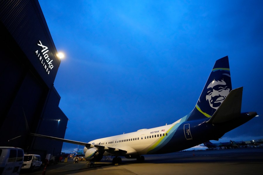 File - An Alaska Airlines Boeing 737 Max 9 aircraft awaits inspection outside the airline's hangar at Seattle-Tacoma International Airport Jan. 10, 2024, in SeaTac, Wash. Boeing declined to offer its own forecast of 2024 results — an indication of the uncertainty swirling around the company since a 737 Max 9 operated by Alaska Airlines suffered a midflight blowout of a panel called a door plug on Jan. 5. (AP Photo/Lindsey Wasson, File)