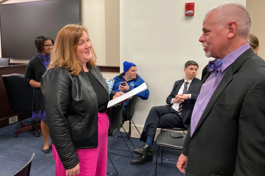 Kentucky state Rep. Lindsey Burke, left, chats before speaking at a news conference, Wednesday, Jan. 31, 2024, in Frankfort, Ky. Burke unveiled a bill aimed at restoring abortion access in Kentucky. The state currently has a near-total ban on abortion. (AP Photo/Bruce Schreiner)