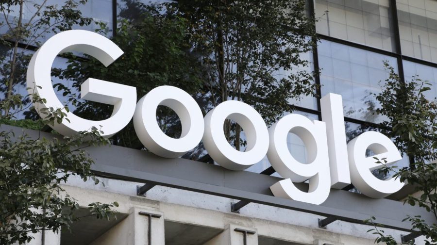 Google sign hangs over an entrance to one of the company's buildings.