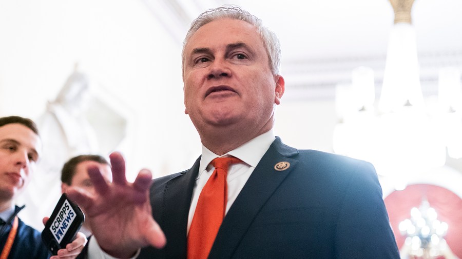 Representative James Comer gestures while speaking to reporters.