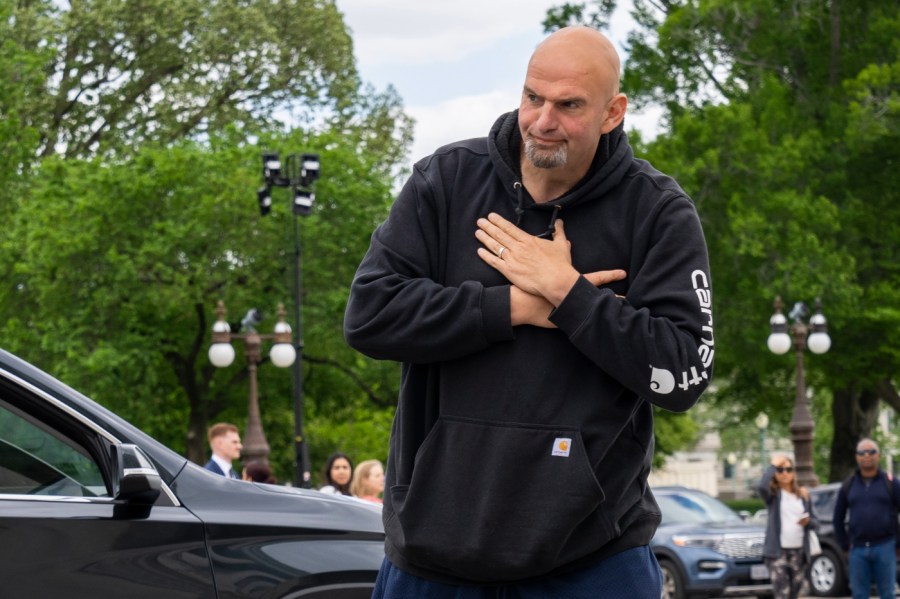 Sen. John Fetterman, D-Penn., holds his hands over his heart as he gestures to members of the media on his return to the Capitol after seeking inpatient treatment for clinical depression, Monday, April 17, 2023, on Capitol Hill in Washington.