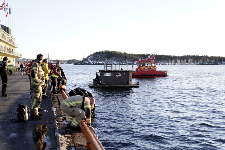 A car is retrieved from the water after driving out into the Oslofjord, in Oslo, Norway, Thursday Feb. 1, 2024. (Hakon Mosvold Larsen/NTB Scanpix via AP)