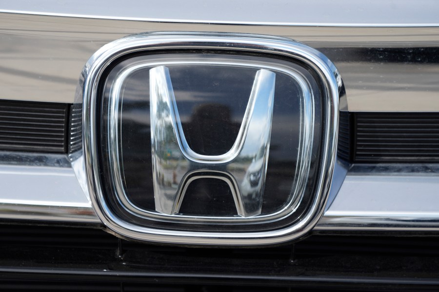 FILE - The Honda company logo is shown outside a Honda dealership Sunday, Sept. 12, 2021, in Highlands Ranch, Colo. Honda is recalling more than three quarters of a million vehicles in the U.S. because a faulty sensor may cause the front passenger air bags to inflate when they're not supposed to. (AP Photo/David Zalubowski, File)