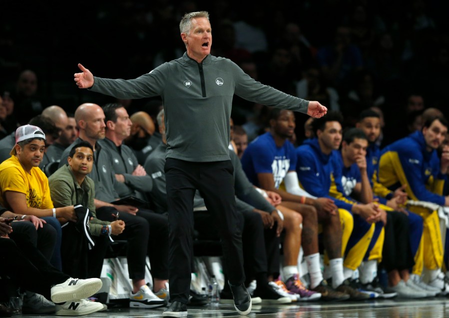 Golden State Warriors head coach Steve Kerr works the sideline during the first half of an NBA basketball game against the Brooklyn Nets, Monday, Feb. 5, 2024, in New York. (AP Photo/John Munson)