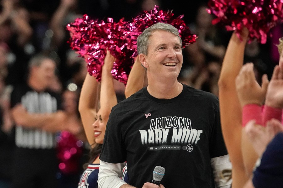 New Arizona head coach Brent Brennan is introduced to the fans during a timeout of their NCAA college basketball game against Southern California Wednesday, Jan. 17, 2024, in Tucson, Ariz. (AP Photo/Darryl Webb)