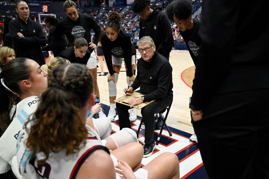 UConn head coach Geno Auriemma talks with his players during a timeout in the first half of an NCAA college basketball game against Seton Hall, Wednesday, Feb. 7, 2024, in Hartford, Conn. (AP Photo/Jessica Hill)