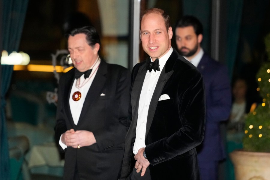 Britain's Prince William looks across to the media as he arrives to attend the London Air Ambulance Charity Gala in London, Wednesday, Feb. 7, 2024. (AP Photo/Kirsty Wigglesworth)